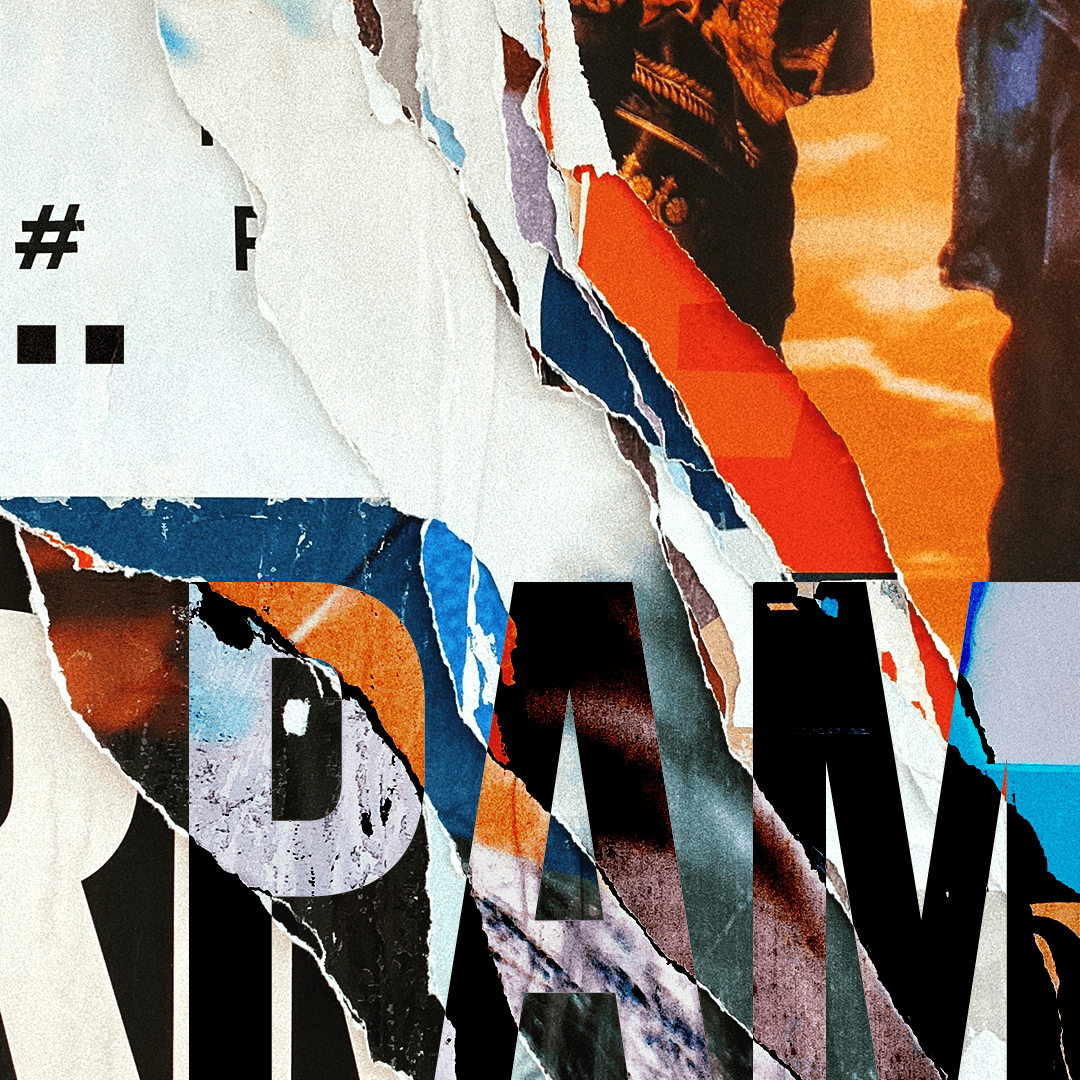 Close-up of layered torn posters with colorful fragments and partially visible letters and images.