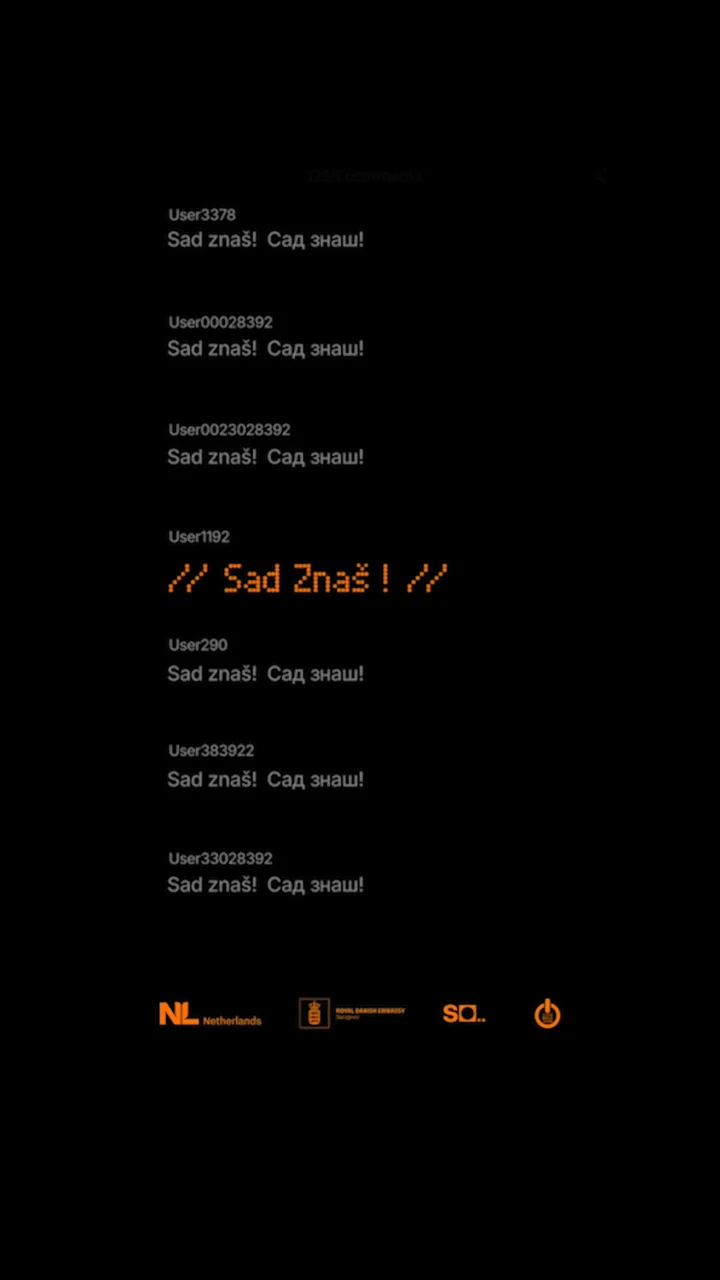 The film's end card: a comment thread, the LED lettering and the partner strip on black.